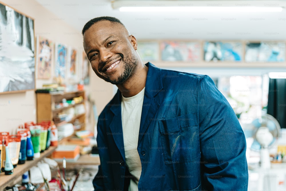 a man in a blue jacket standing in a store