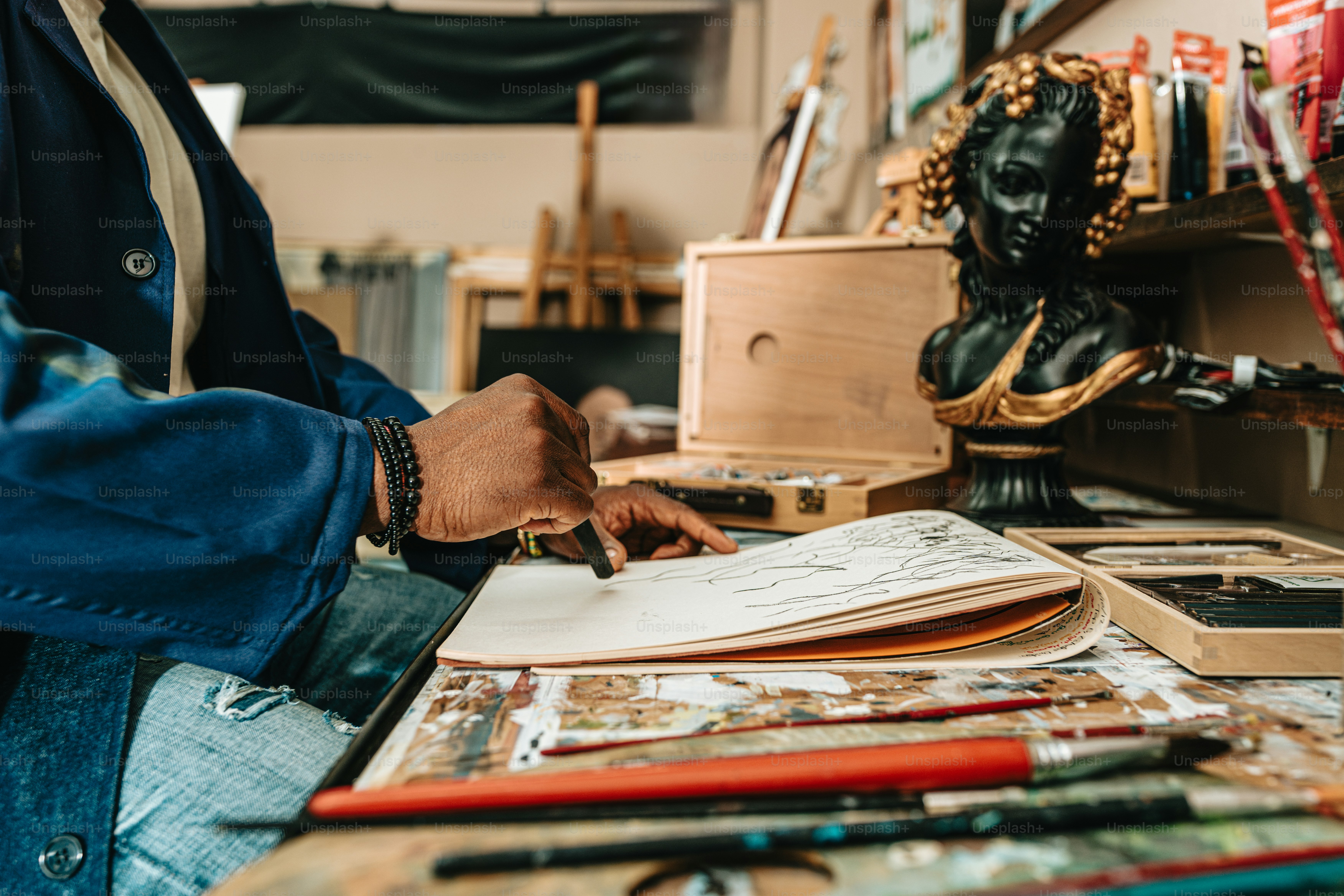 a person sitting at a table with a book