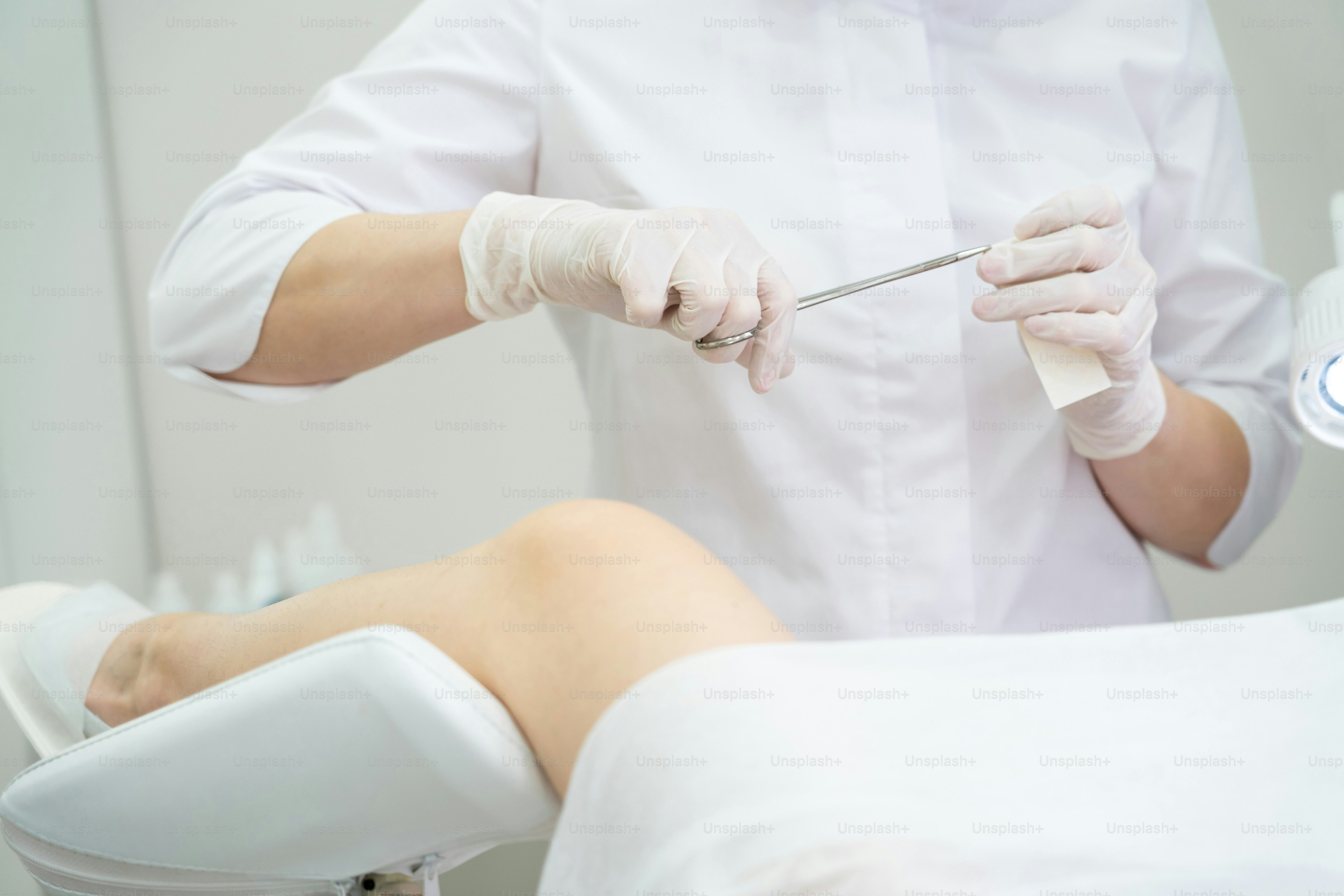 Young woman patient with a gynecologist during the consultation in the gynecological office