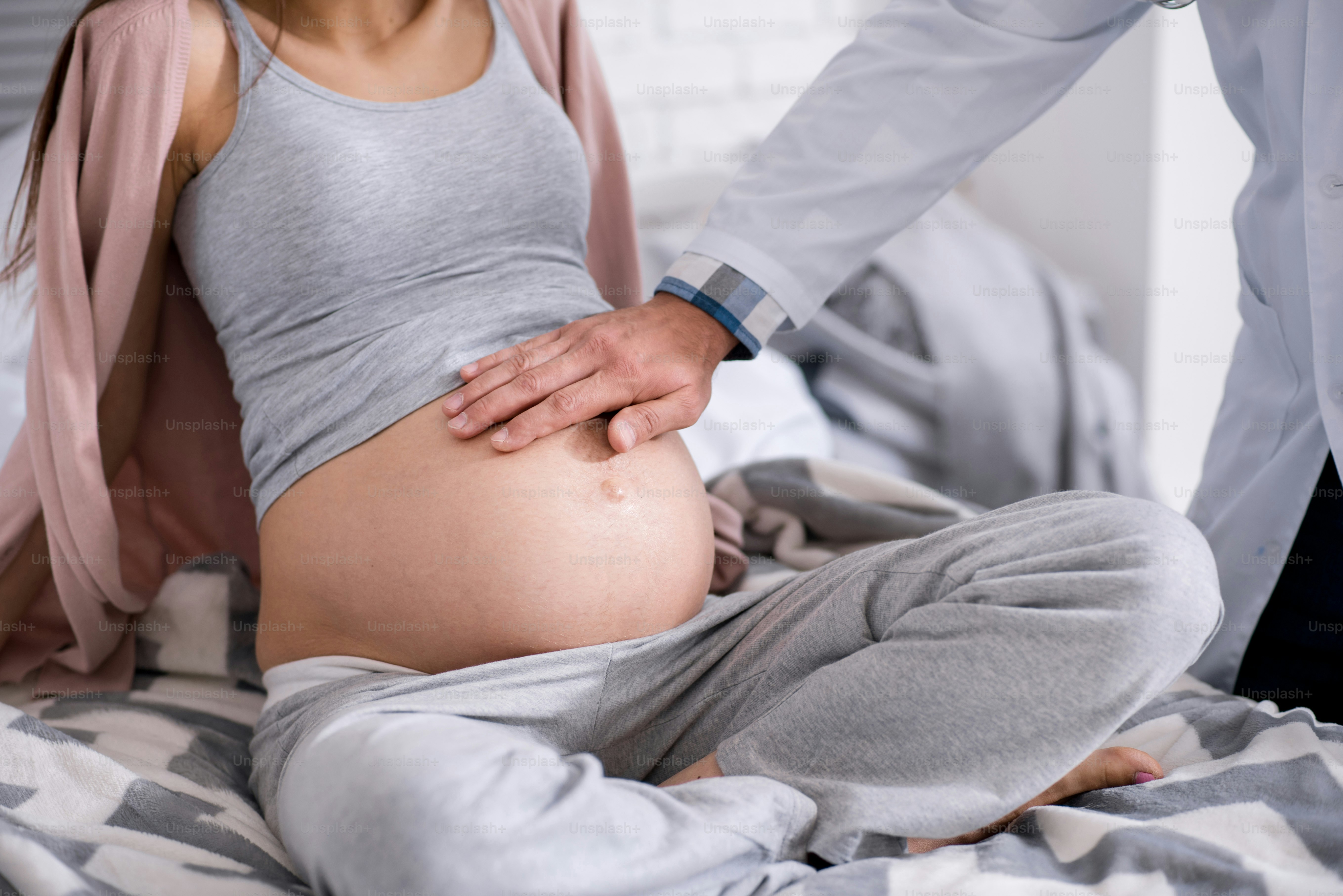 Comfort pose. Relaxed female person crossing legs while being at health examination and leaning on both arms