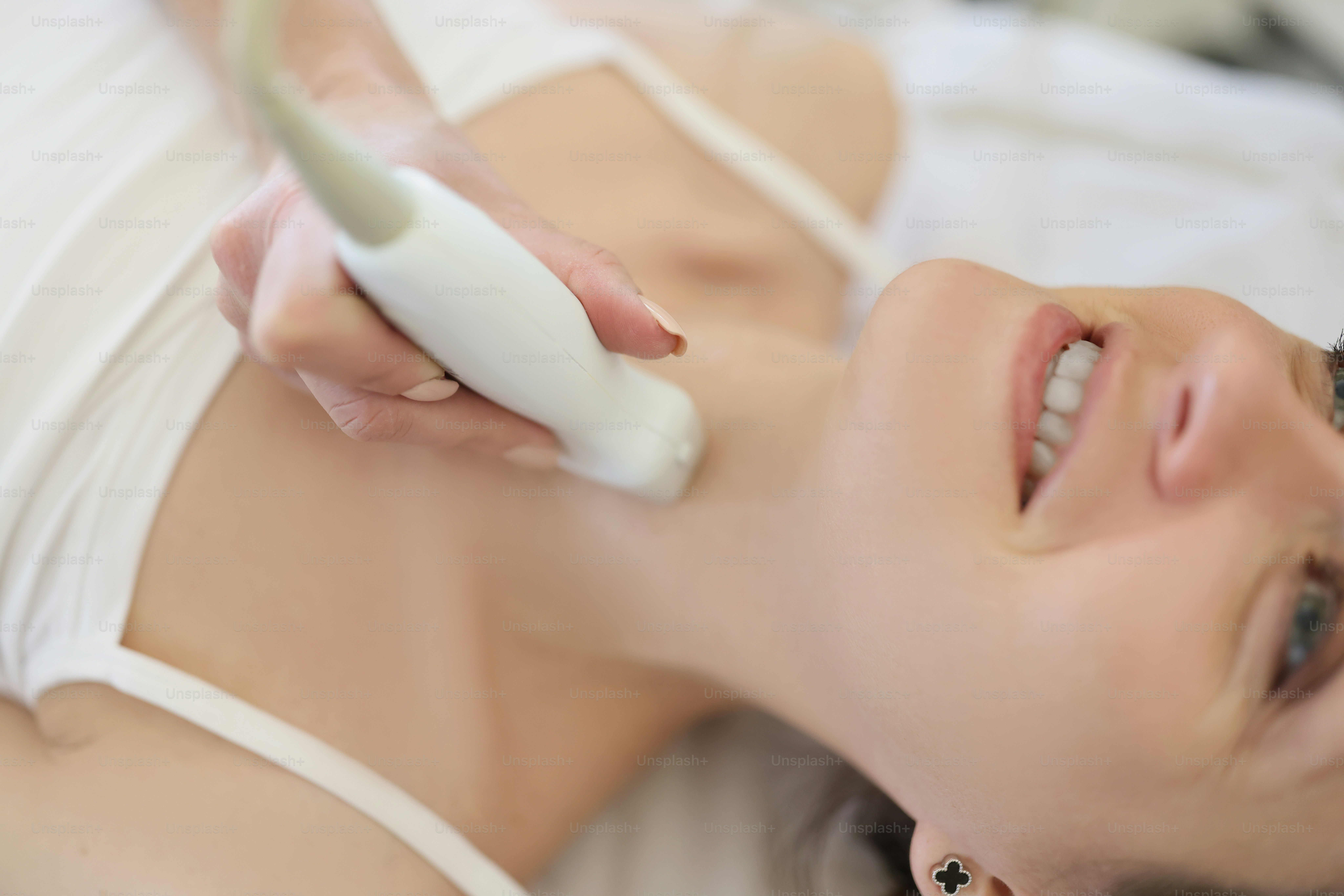 Professional screening doctor performs examination of thyroid gland. Thyroid function screening concept