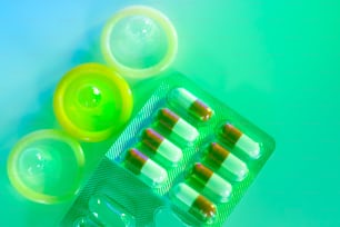 Rubber latex condom male contraceptive and contracptive female hormone birth control pills.