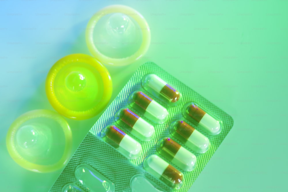 Rubber latex condom male contraceptive and contracptive female hormone birth control pills.