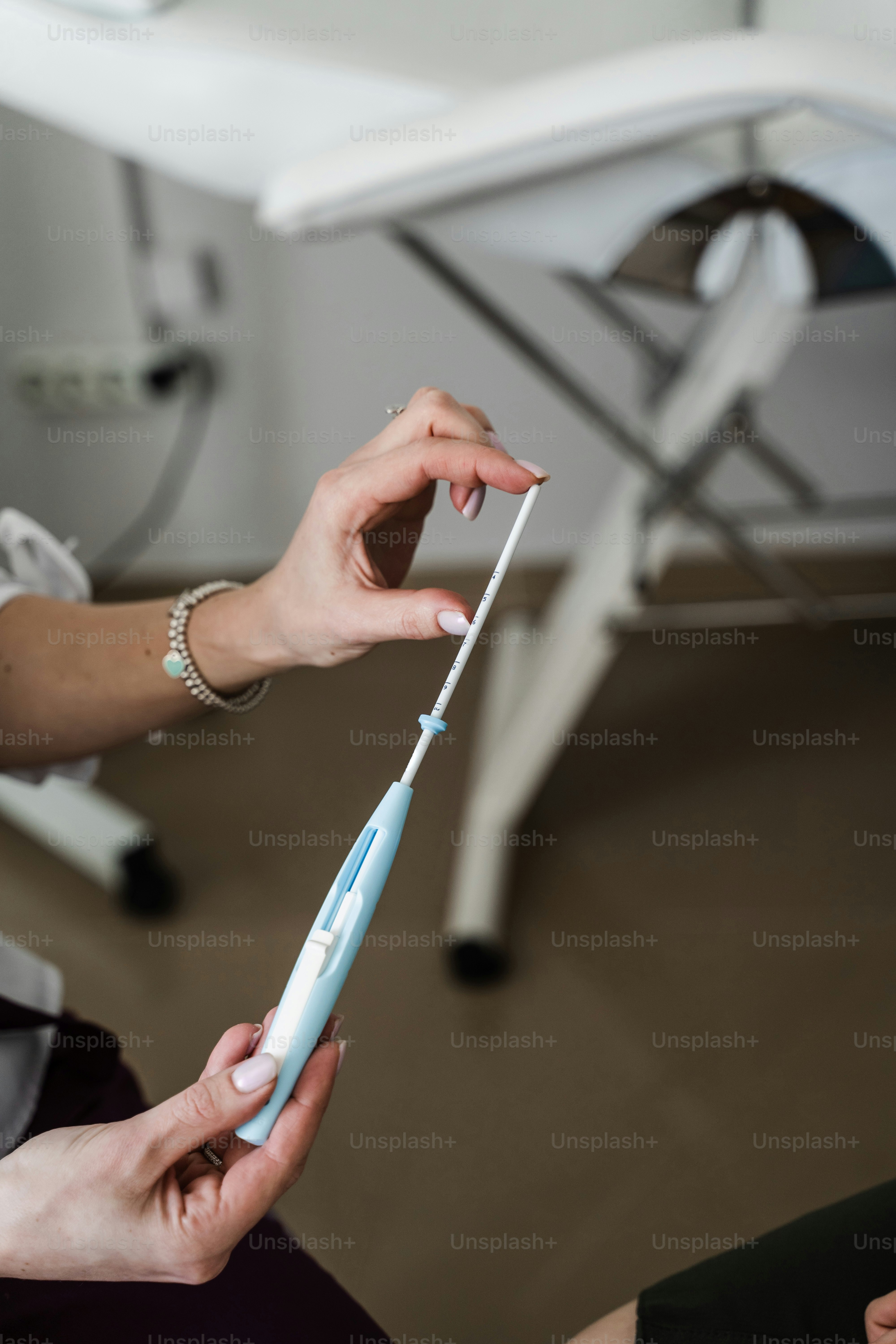 Close-up intrauterine device IUD. Gynecology consultation about IUD intrauterine device is a form of birth control