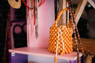 a bag made out of beads on a shelf