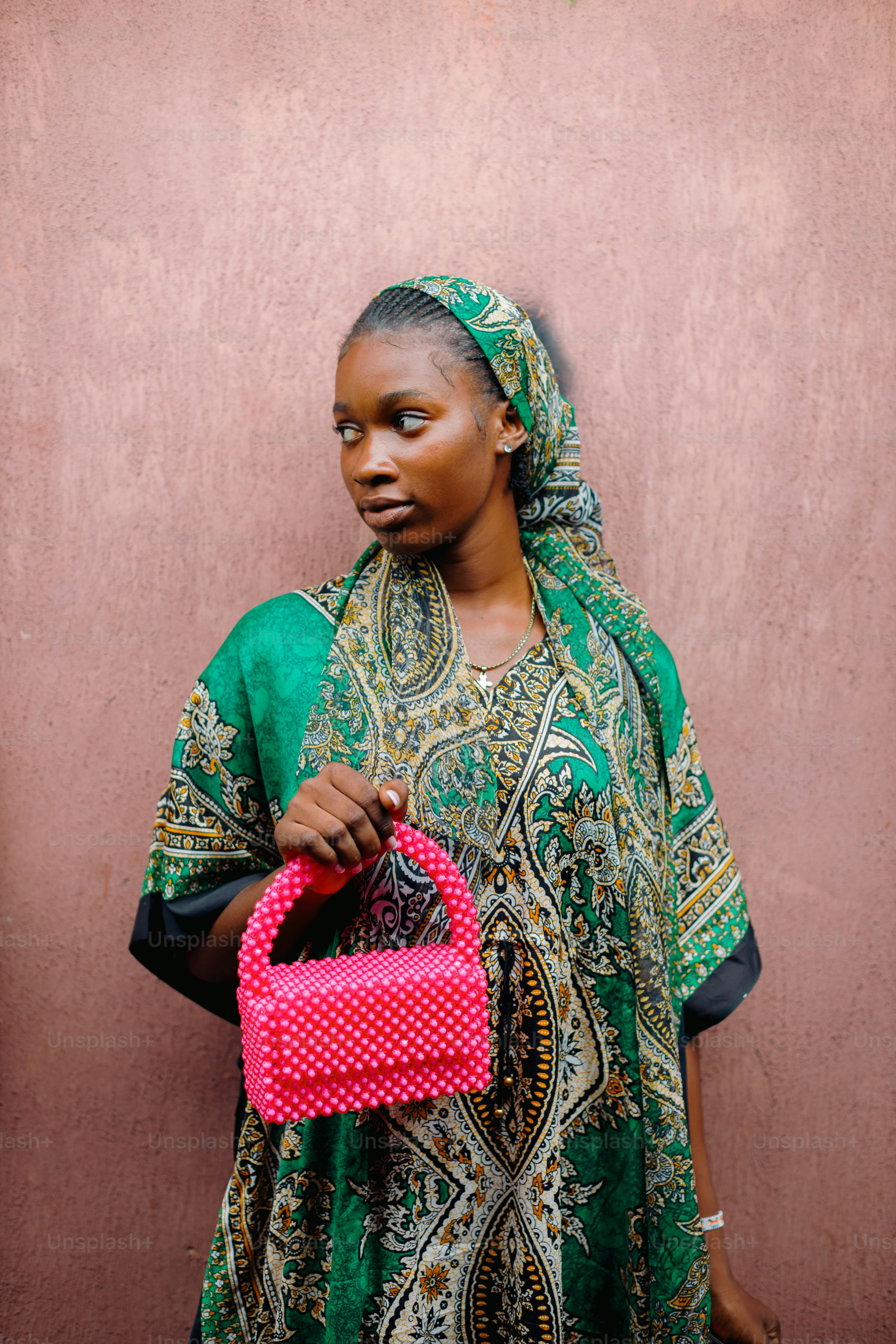 A woman in a green dress holding a pink purse photo  Style Image on  Unsplash