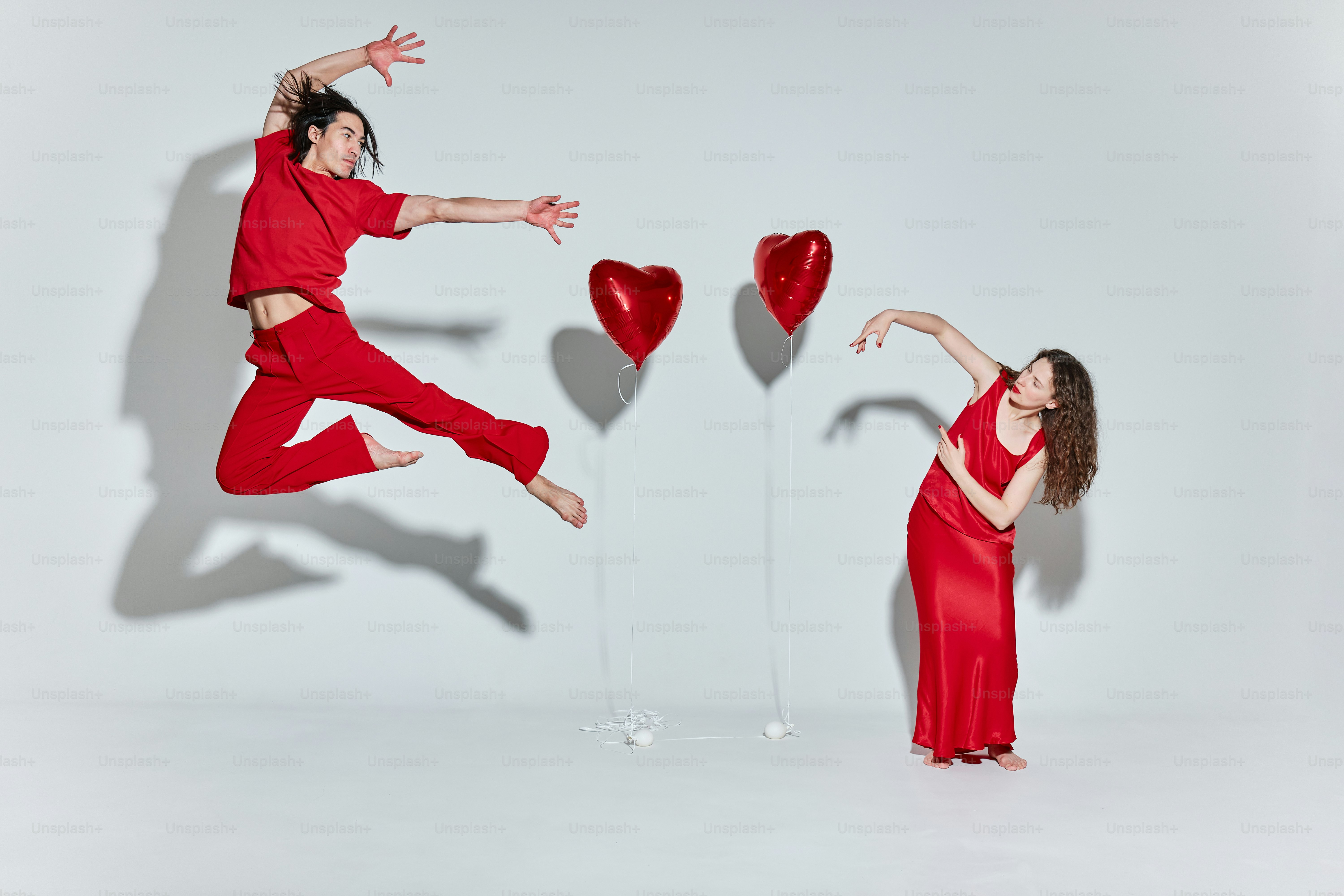 a couple of people that are jumping in the air