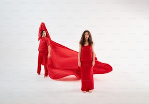 a woman in a red dress and a woman in a red dress with a red
