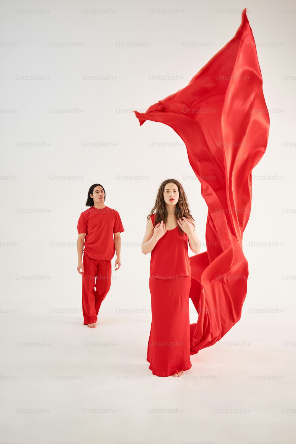 a woman in a red dress and a woman in a red dress with a red
