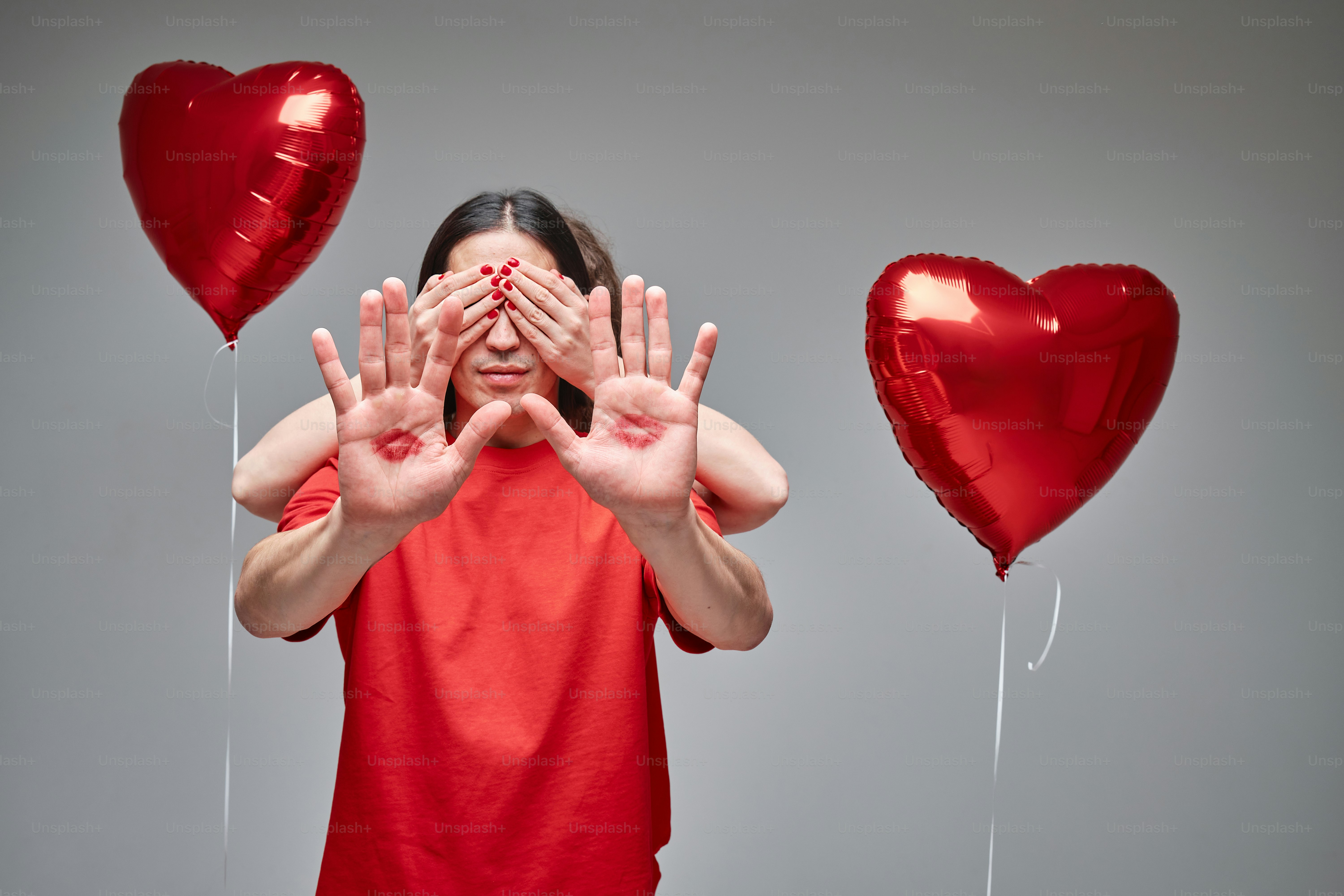 a woman covering her eyes with her hands