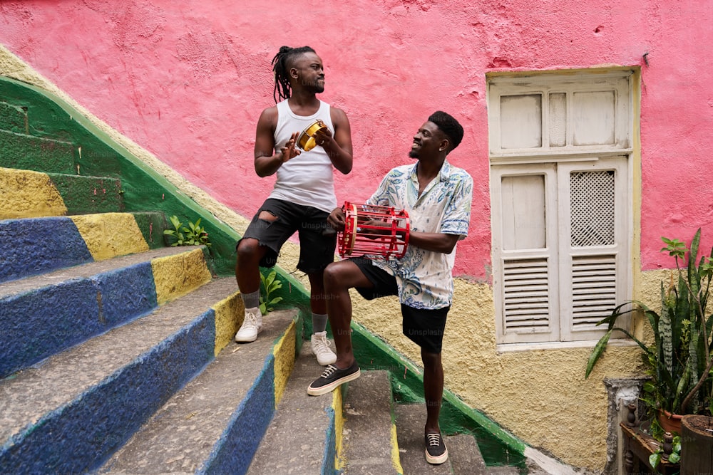 a couple of men standing next to each other