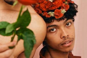 a man with a flower crown on his head