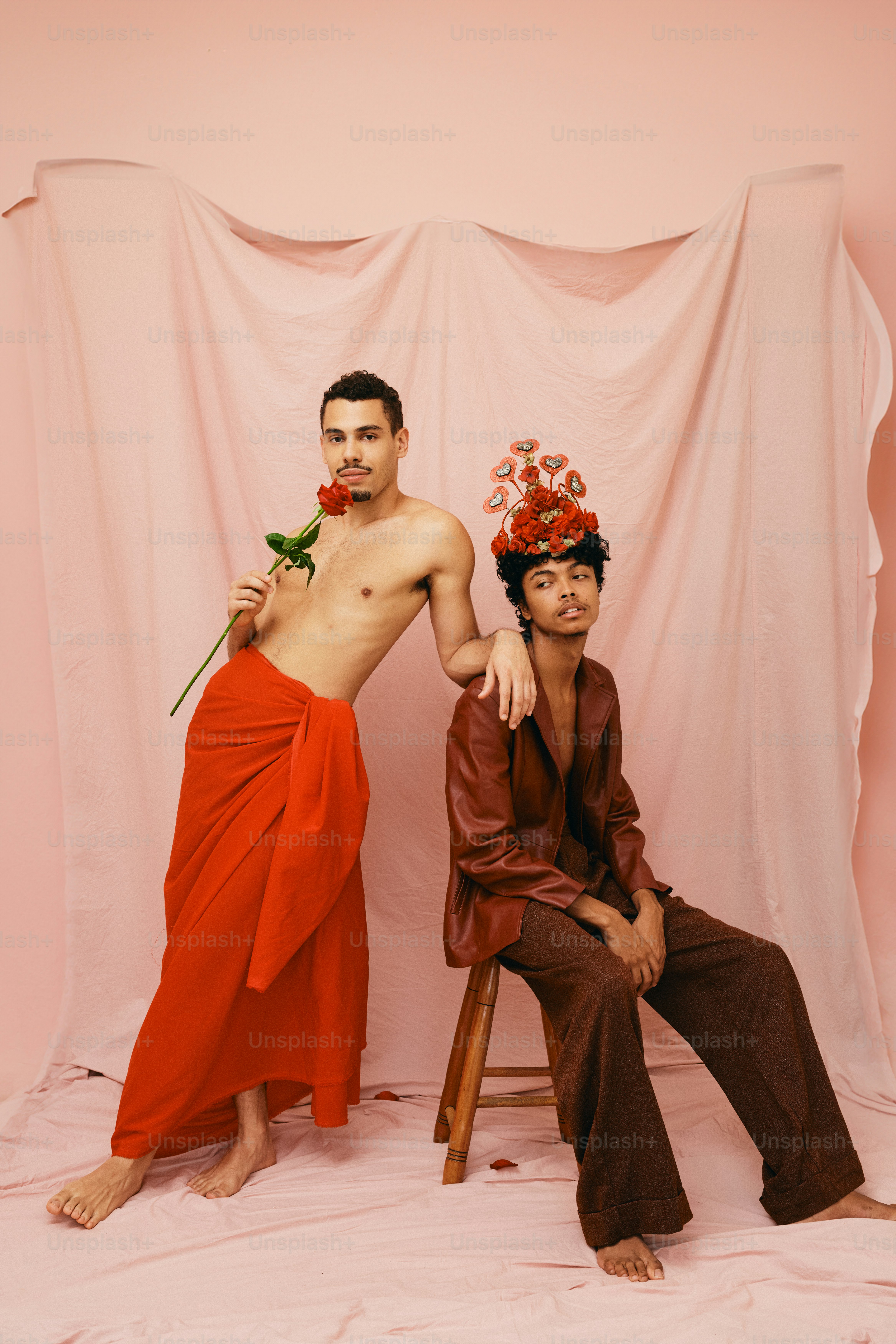 a couple of men sitting next to each other