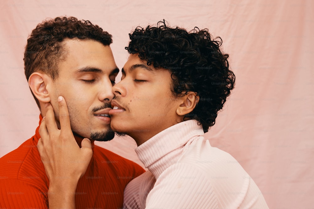 a man and a woman kissing each other