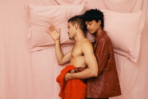 a man and a woman standing next to each other in bed