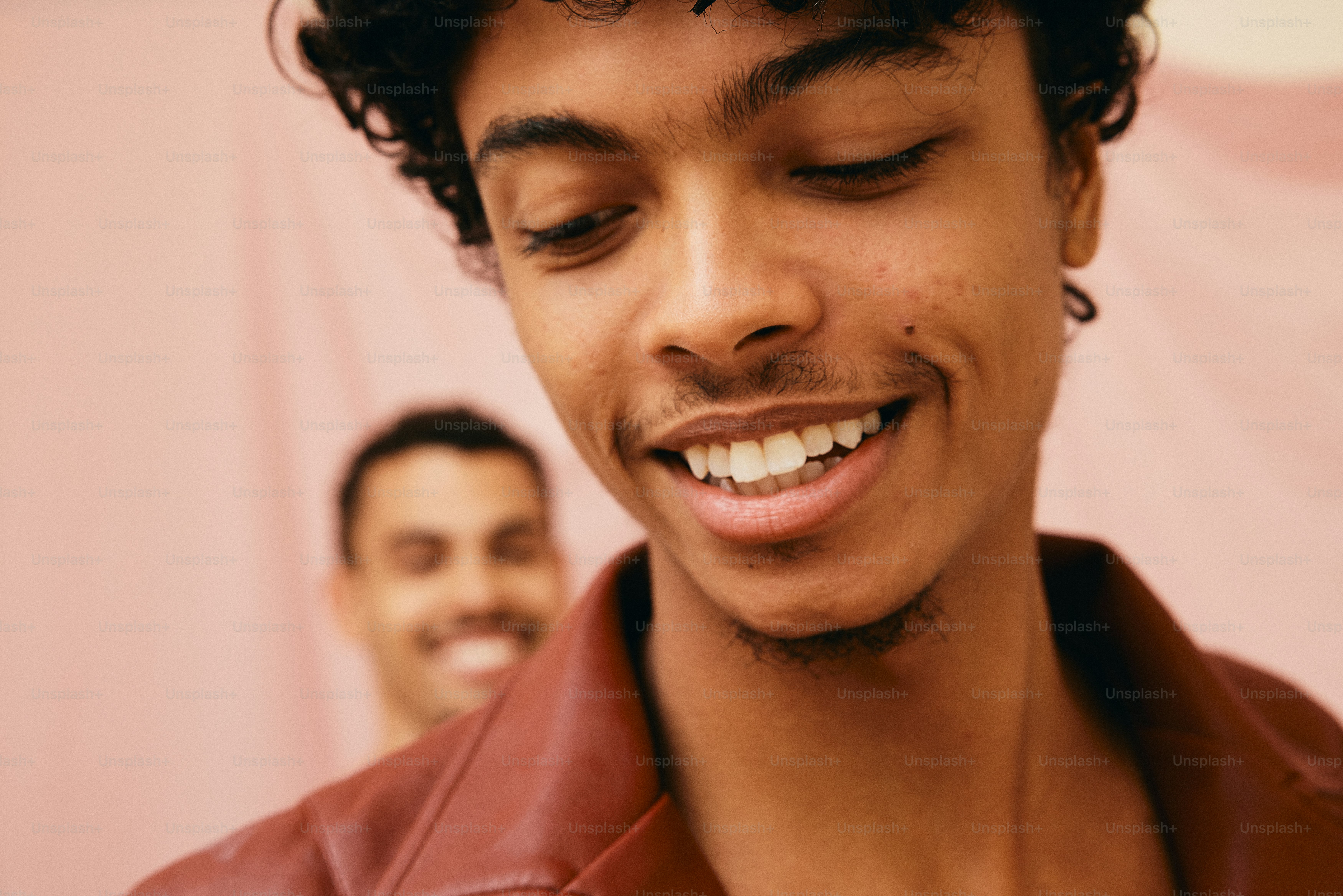 a close up of a person wearing a leather jacket