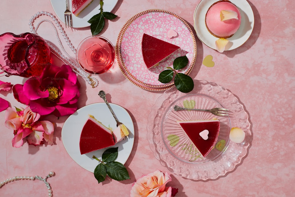 a table topped with plates of pie and flowers