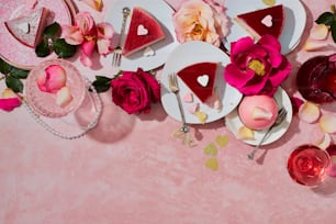 a table topped with plates and flowers on top of a table