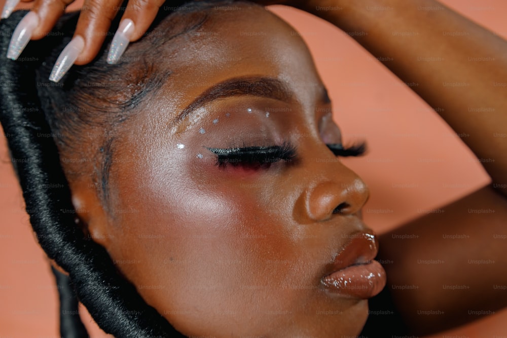 a close up of a woman's face with makeup