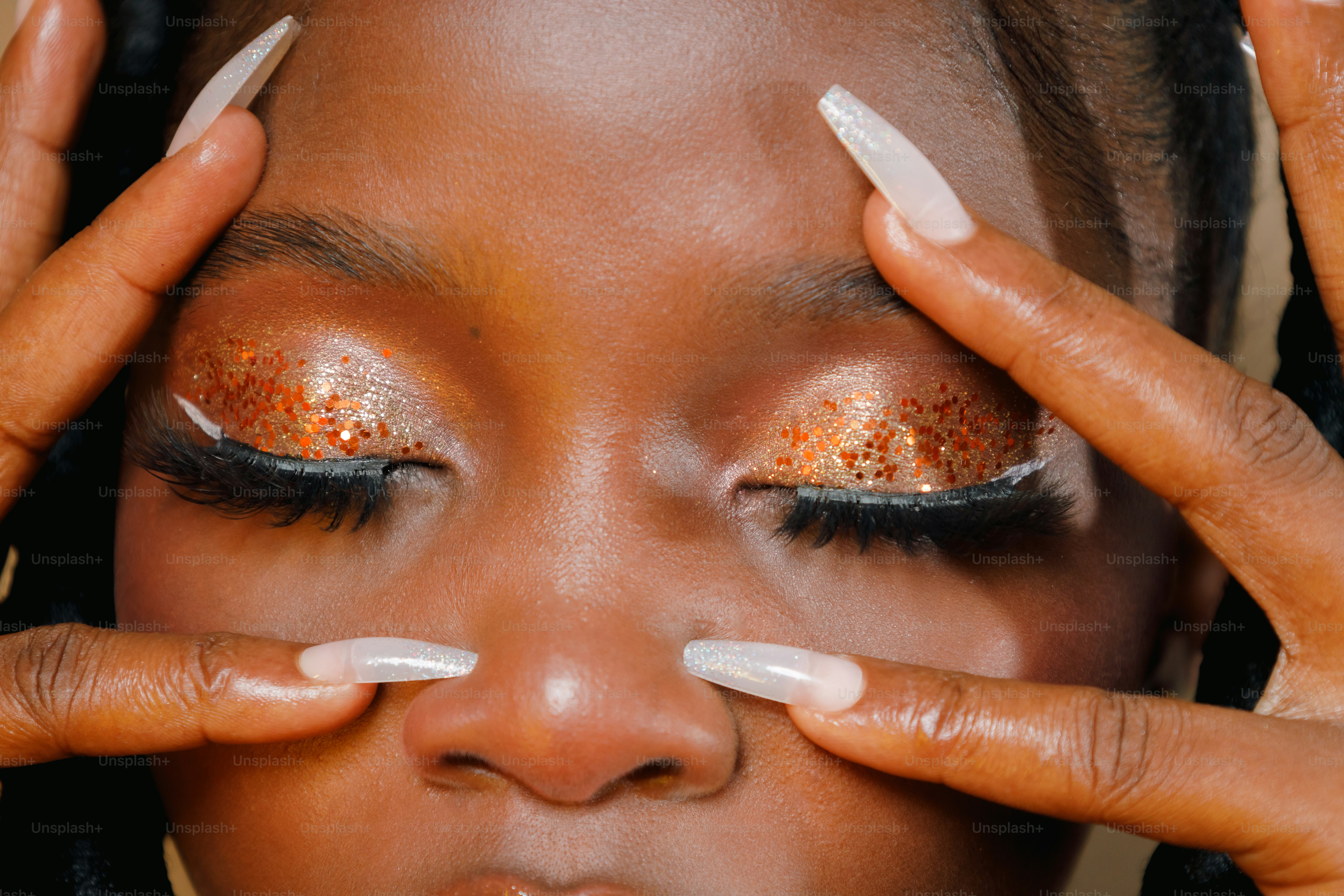 a close up of a person with glitter on their eyes