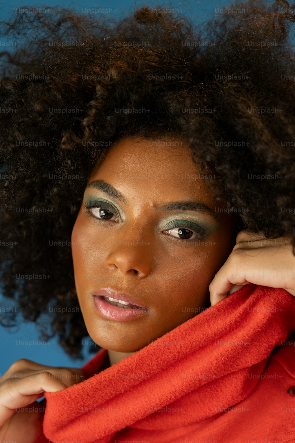 a close up of a person wearing a red shirt