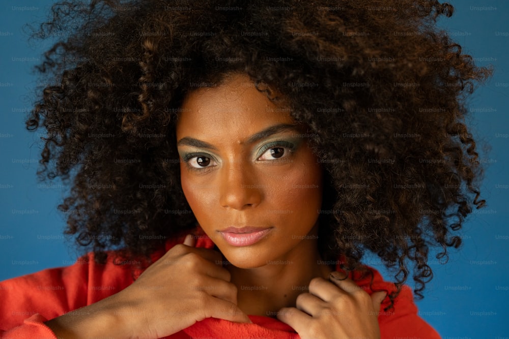 a close up of a person wearing a red shirt