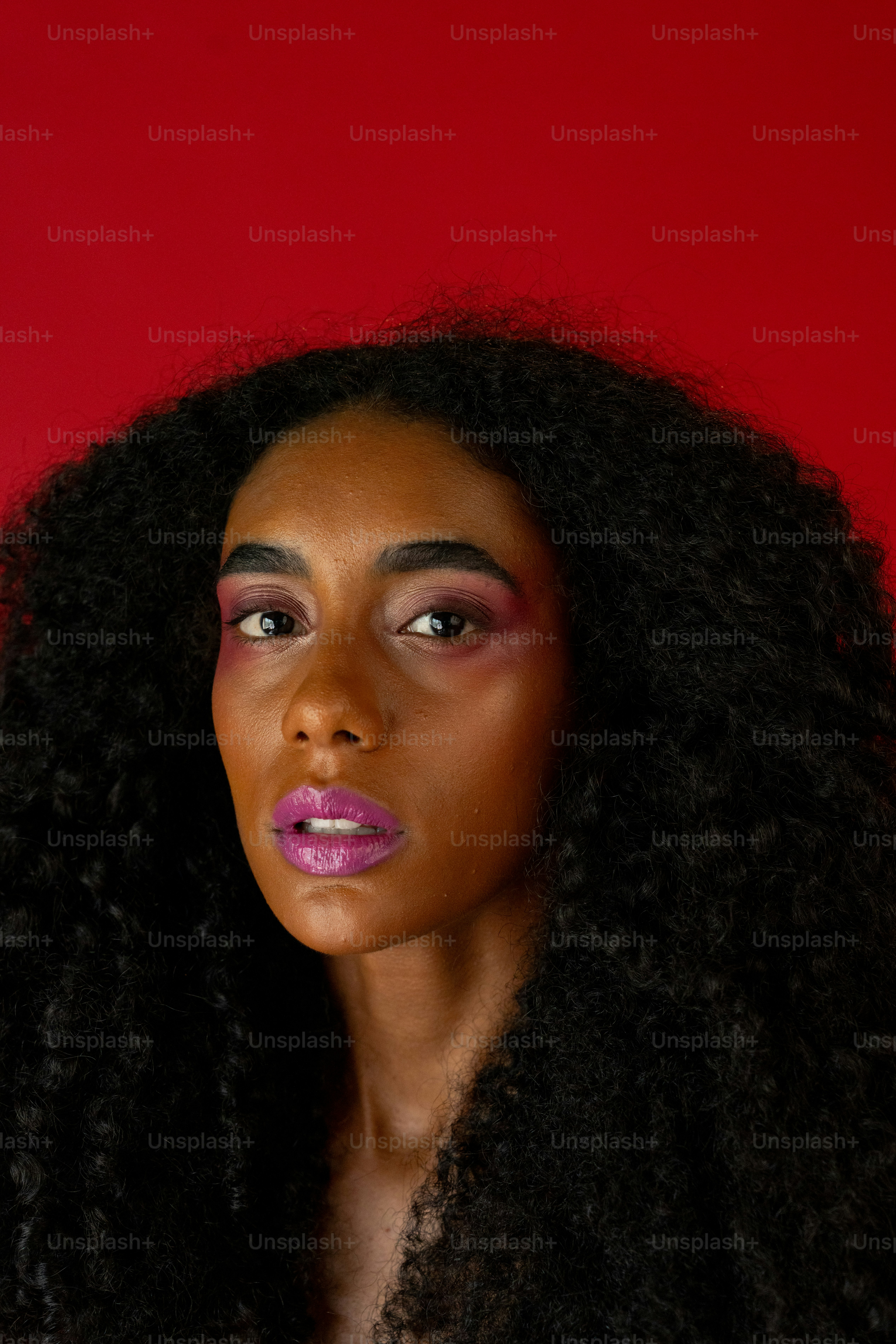 A woman with long black hair and a red background photo – Actress Image ...
