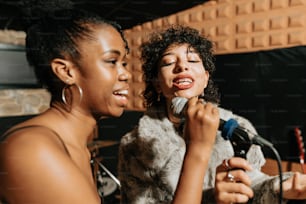 a couple of women standing next to each other