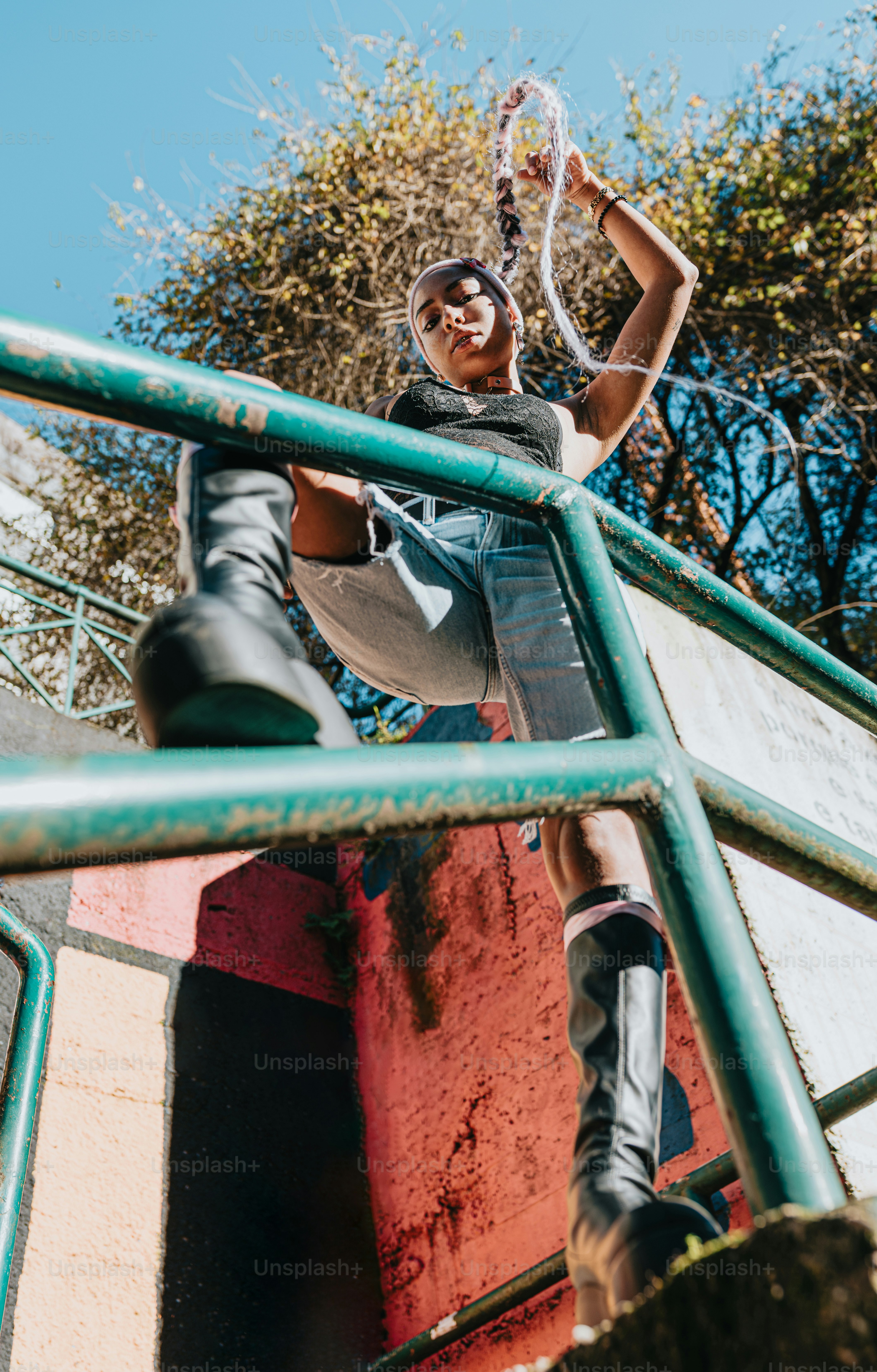 a man riding a skateboard up the side of a metal rail