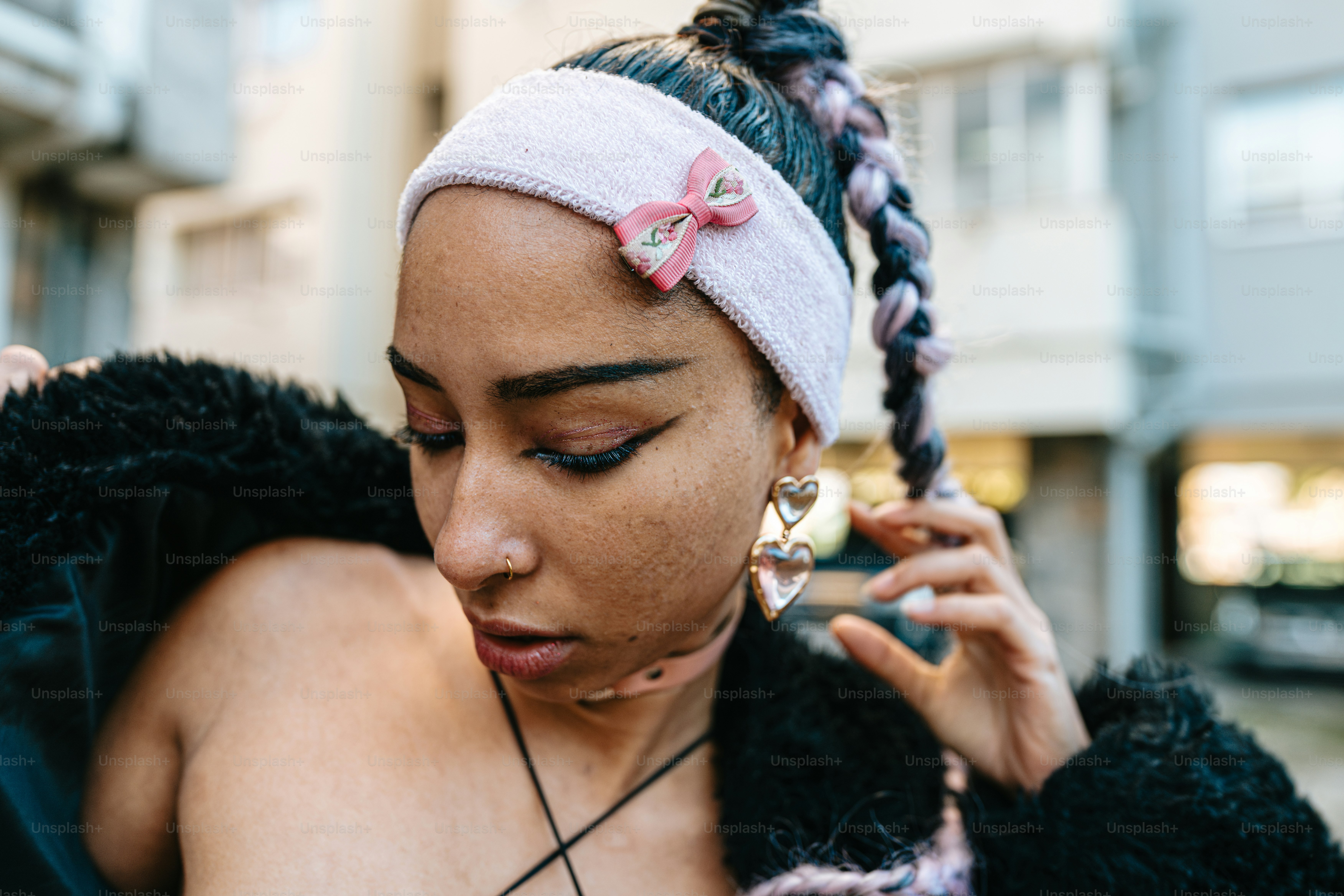 a woman with a pink bow on her head