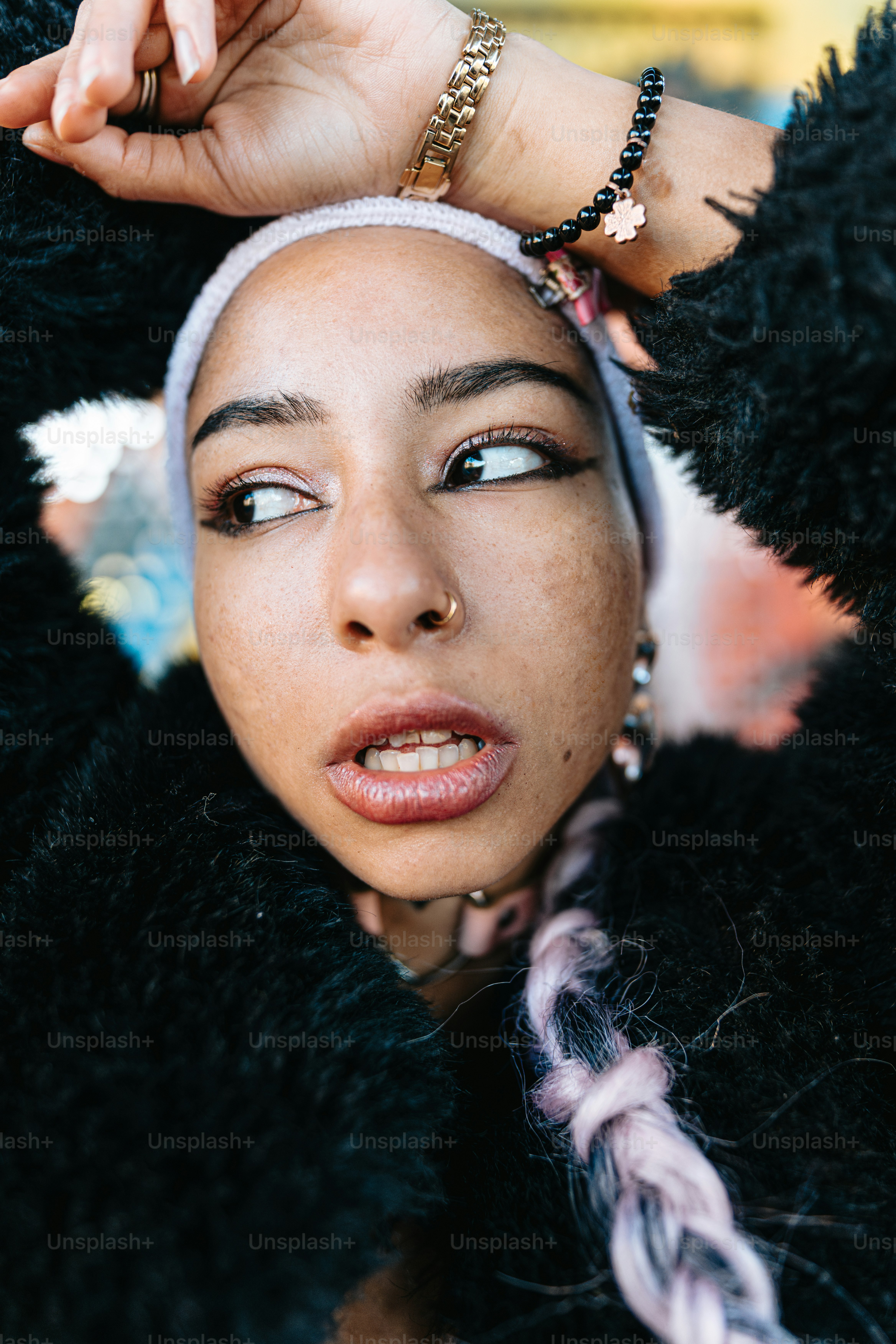 a close up of a person wearing a head band