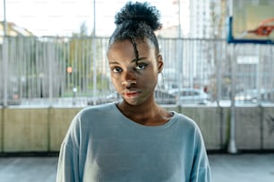 a woman standing in front of a window with a surprised look on her face