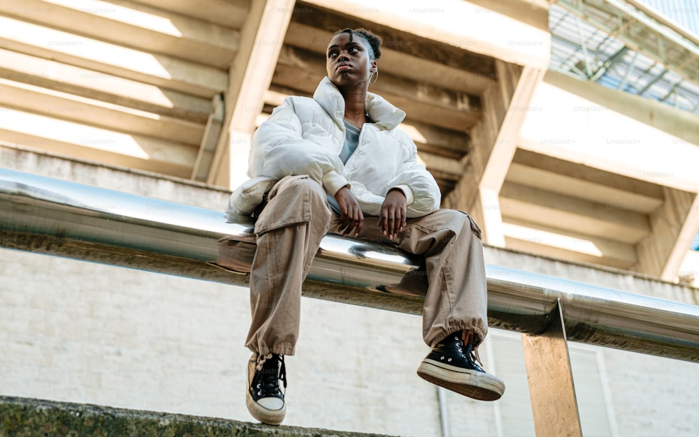 a man sitting on a ledge with his feet up