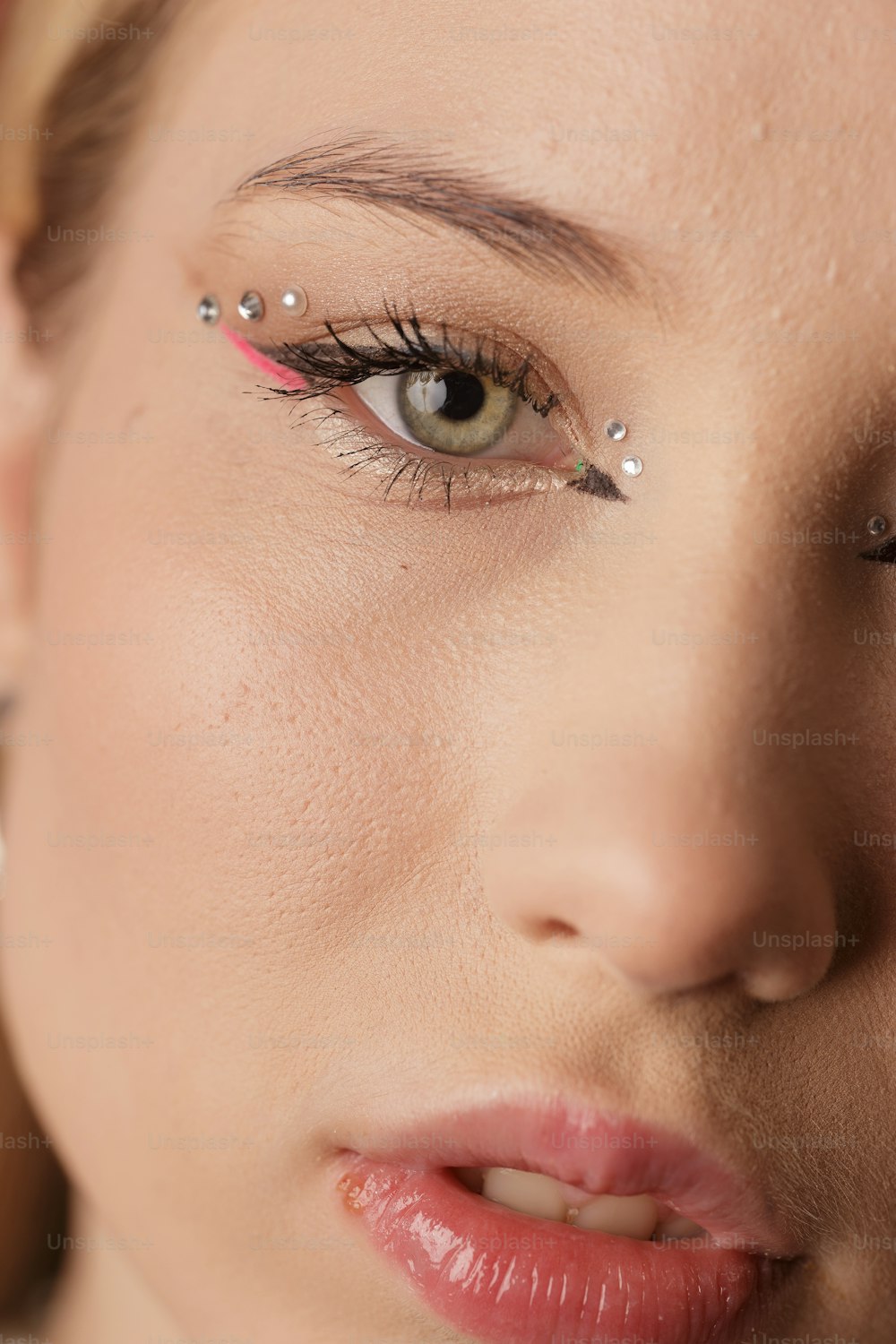 a close up of a woman wearing a pair of fake eyelashes