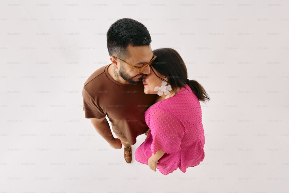 a man and a woman standing next to each other