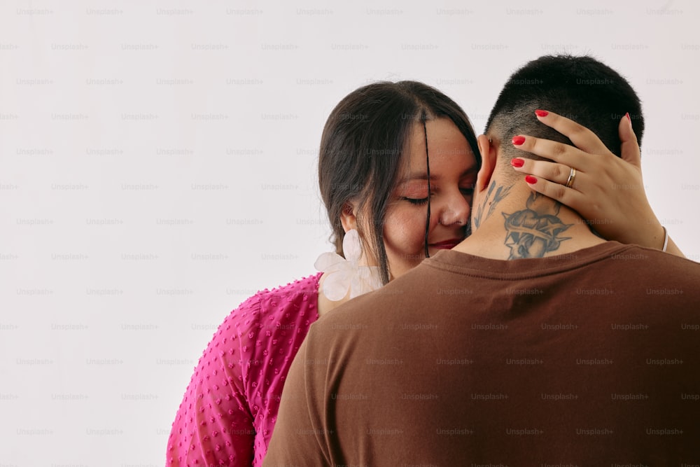 a man and a woman embracing each other