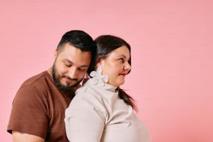 a man and a woman standing next to each other