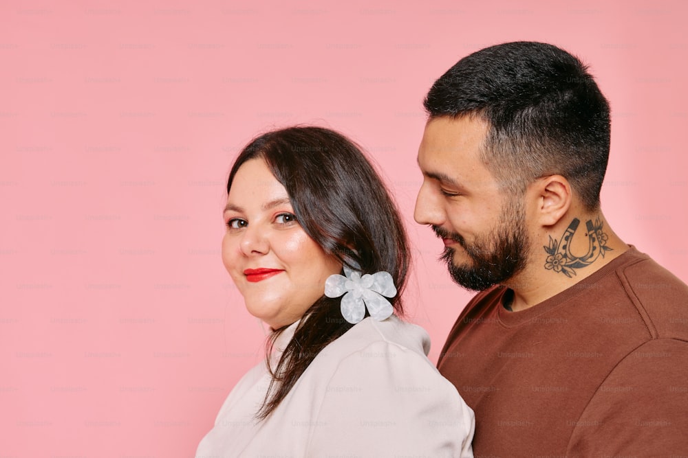 a man and a woman standing next to each other