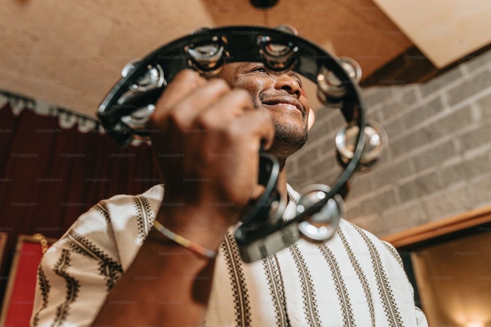 a man holding a pair of scissors up to his face