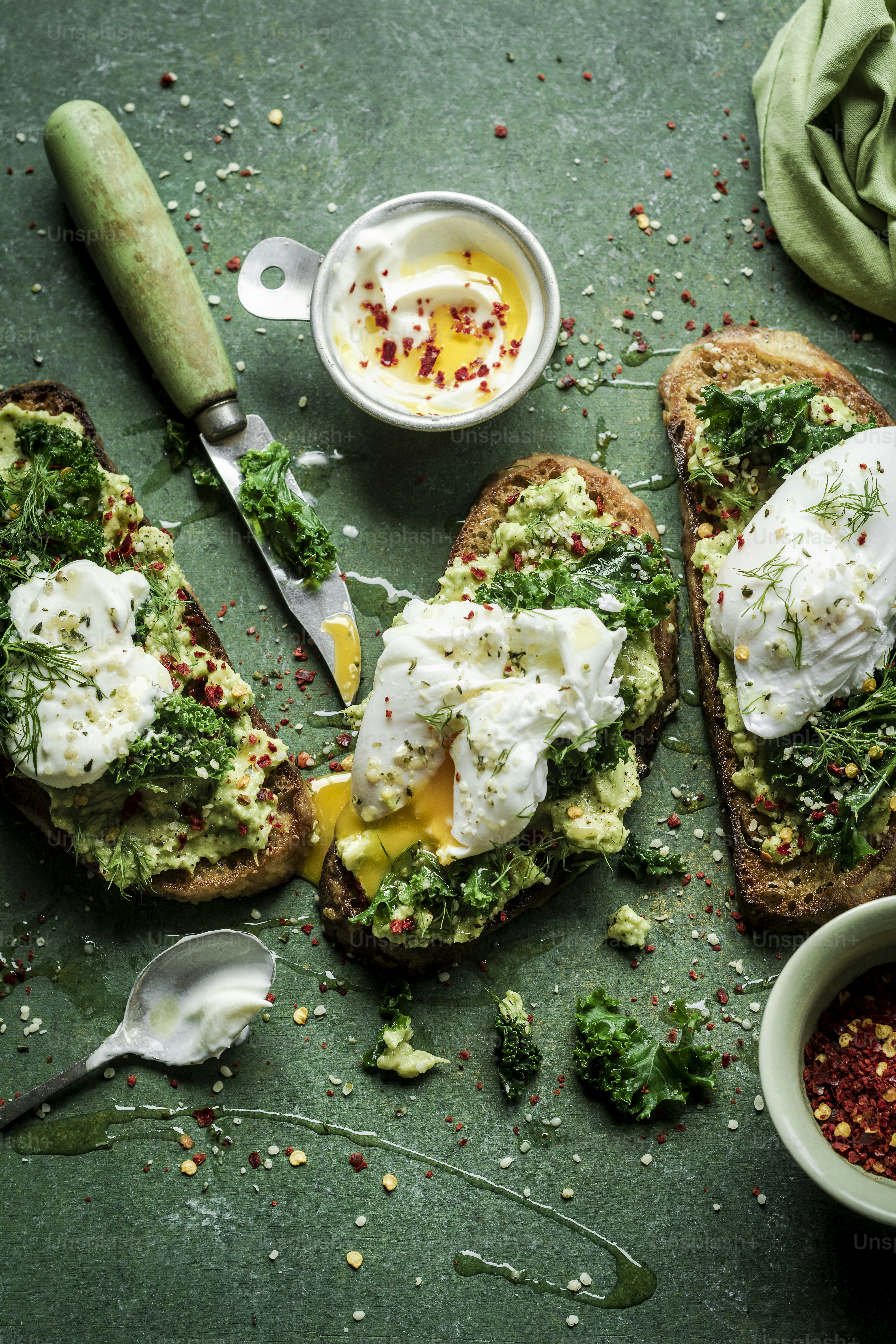 A table topped with toast covered in toppings photo – Healthy food ...