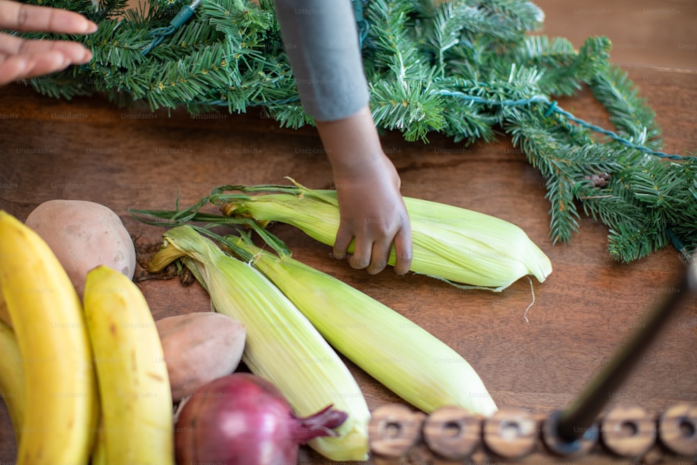 a person cutting up some vegetables on a table