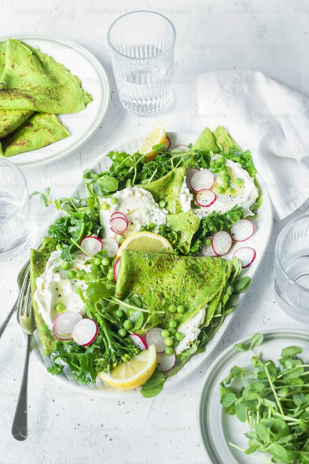 a white plate topped with a salad covered in veggies