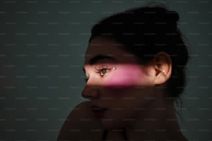 a woman's face is shown with the light coming through her eyes