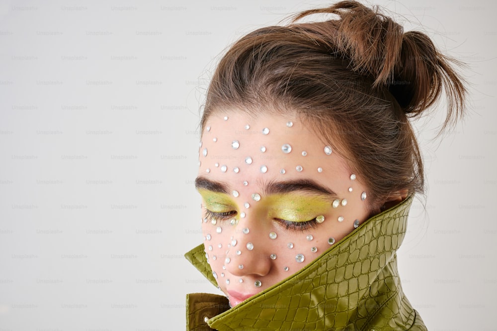 a woman with white dots on her face