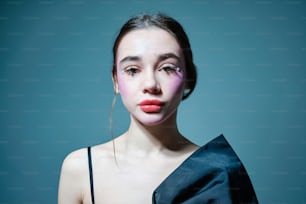 a woman with pink makeup on her face