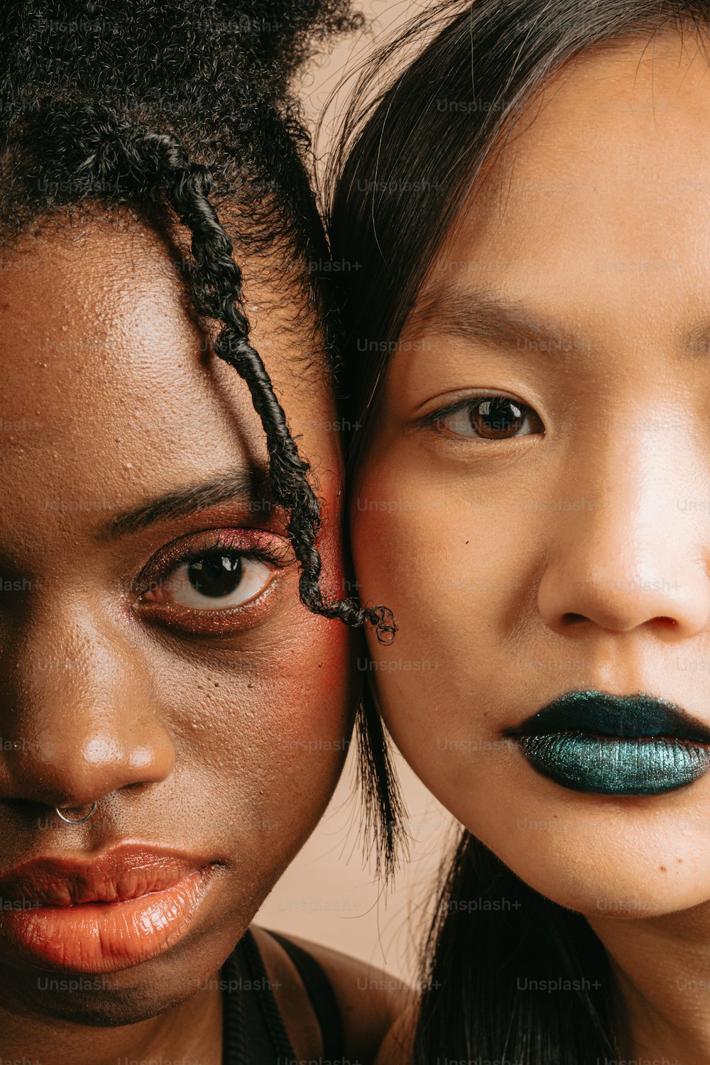 two young women with makeup on their faces