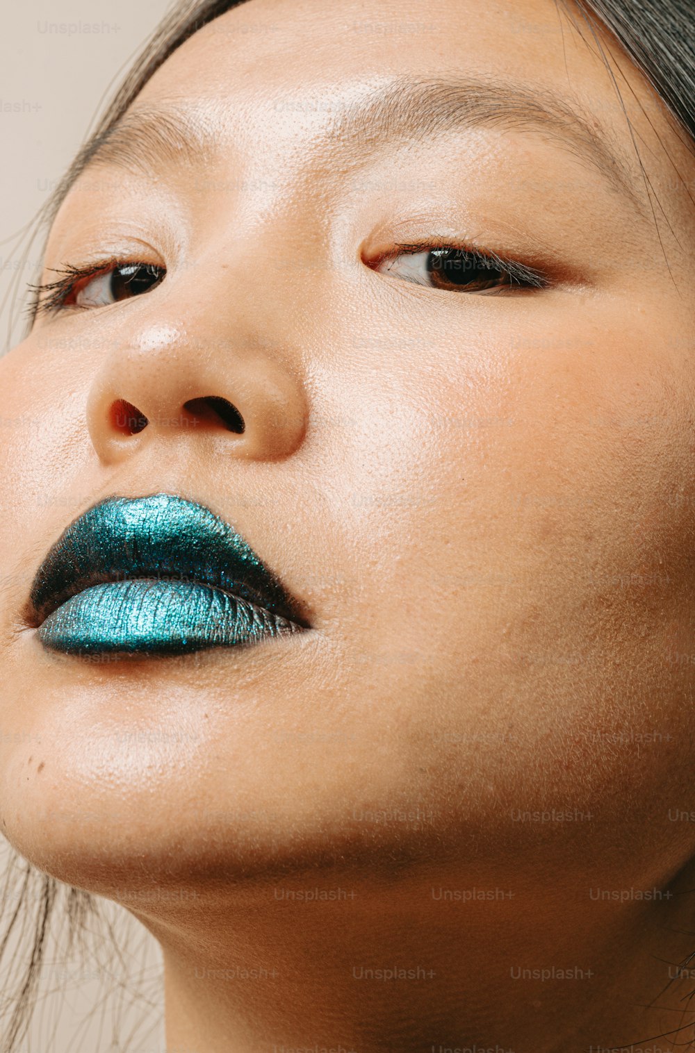 a close up of a person with a blue lipstick