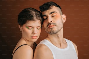 a man and a woman with their eyes closed