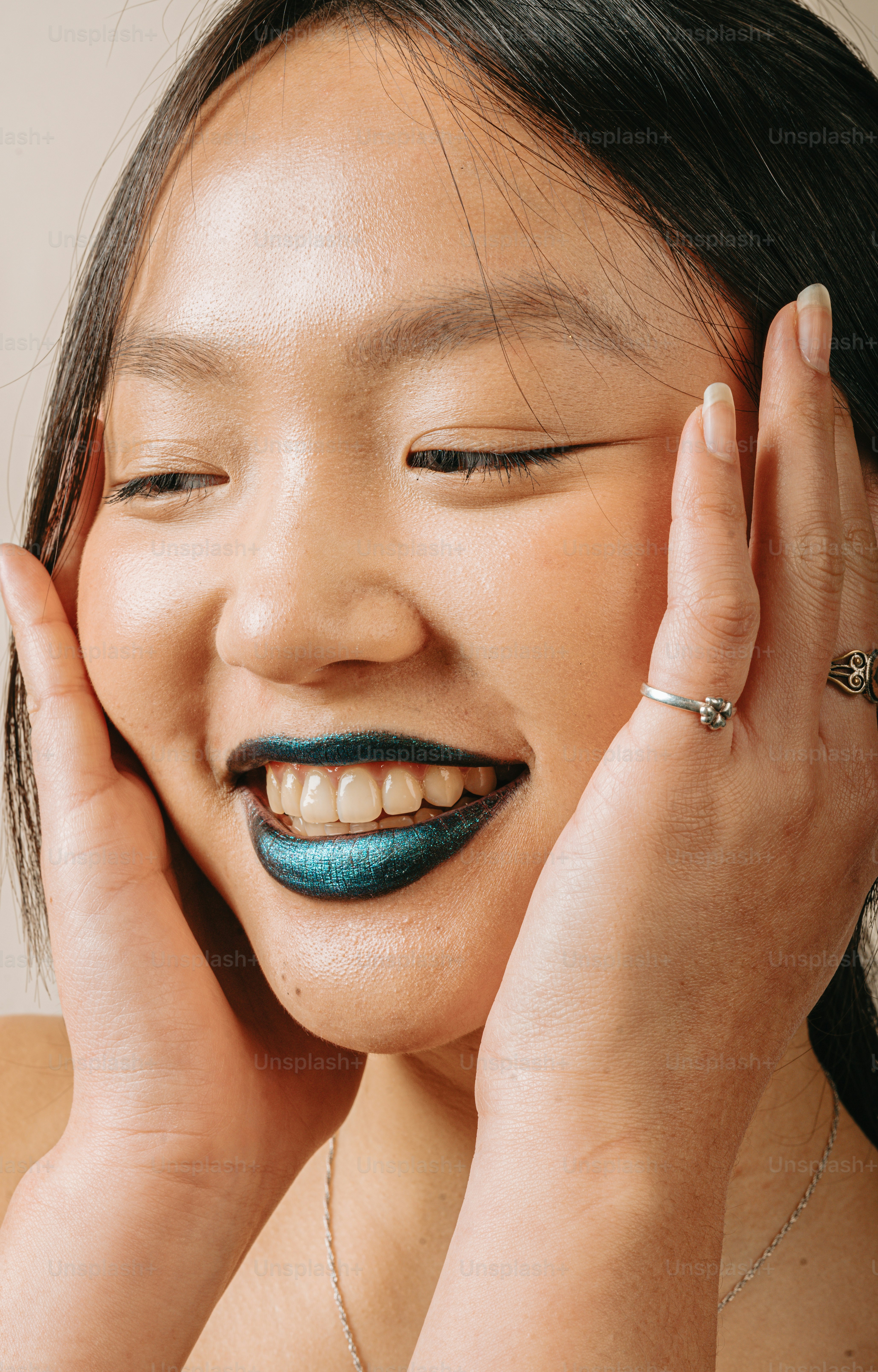 A woman with a blue and black lipstick on her face photo Lipstick
