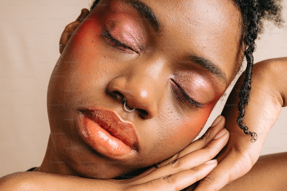 a close up of a woman with her eyes closed